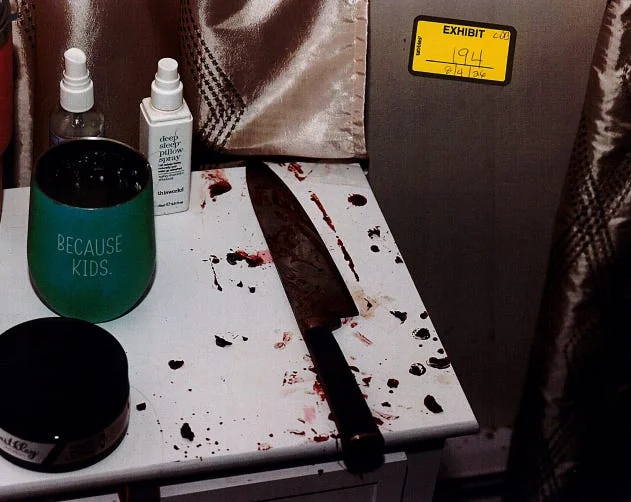 Evidence photograph associated with a knife reportedly found in the bedroom.