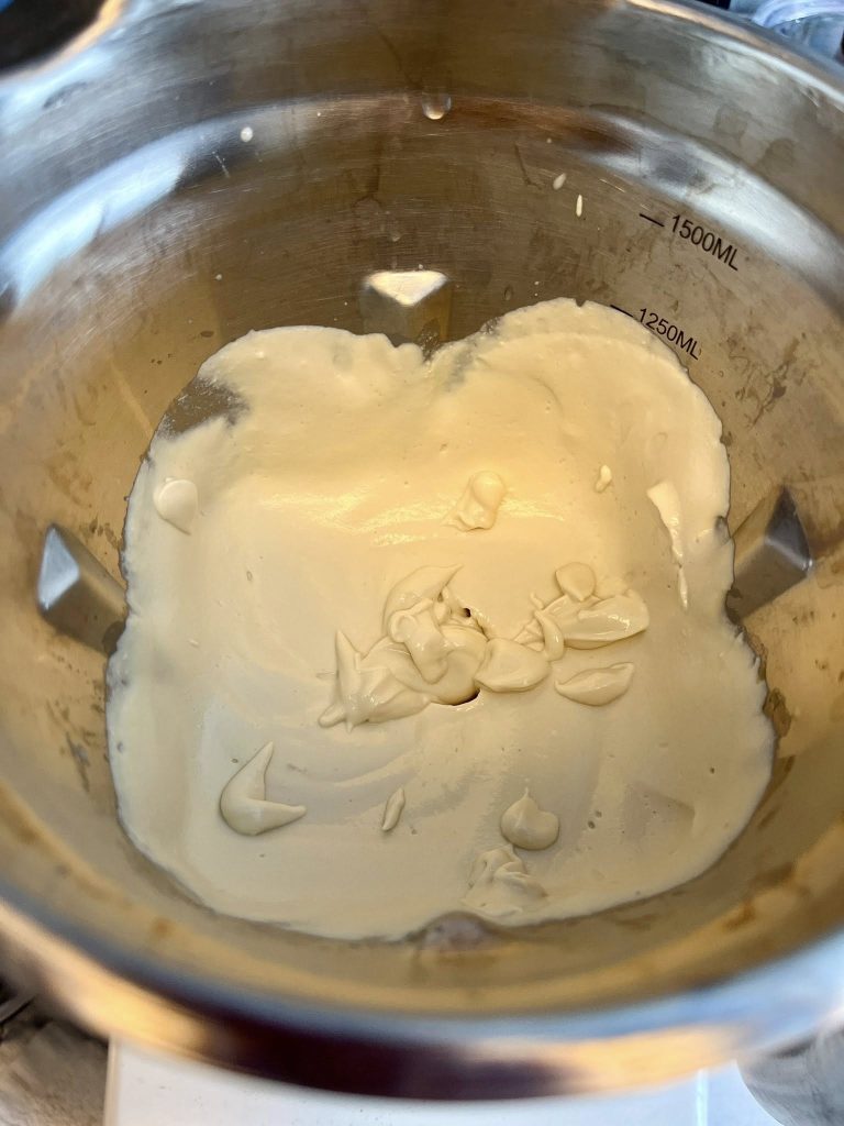 Whipped cream or meringue in stainless steel mixing bowl