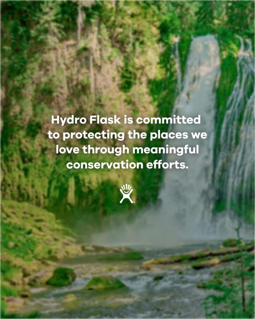 Waterfall in lush forest with Hydro Flask conservation message