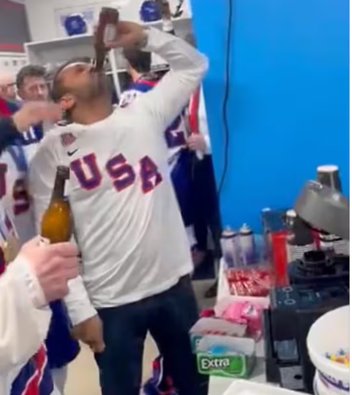 USA team player celebrating in locker room with beer