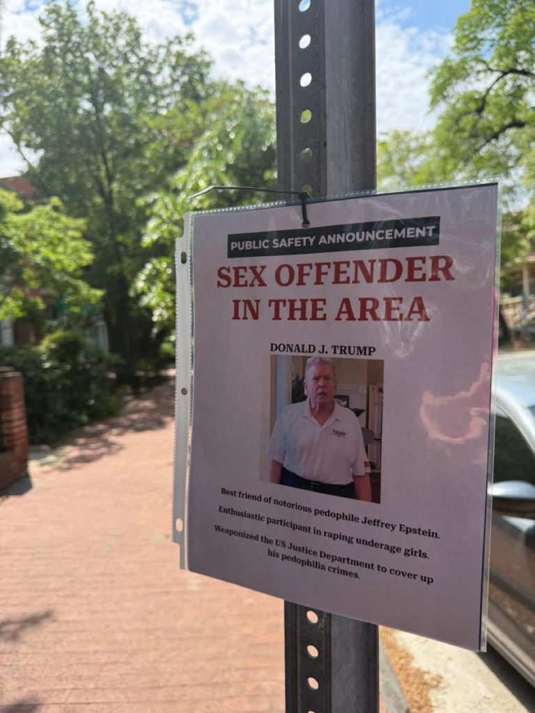 Sign posted on metal pole with public safety announcement