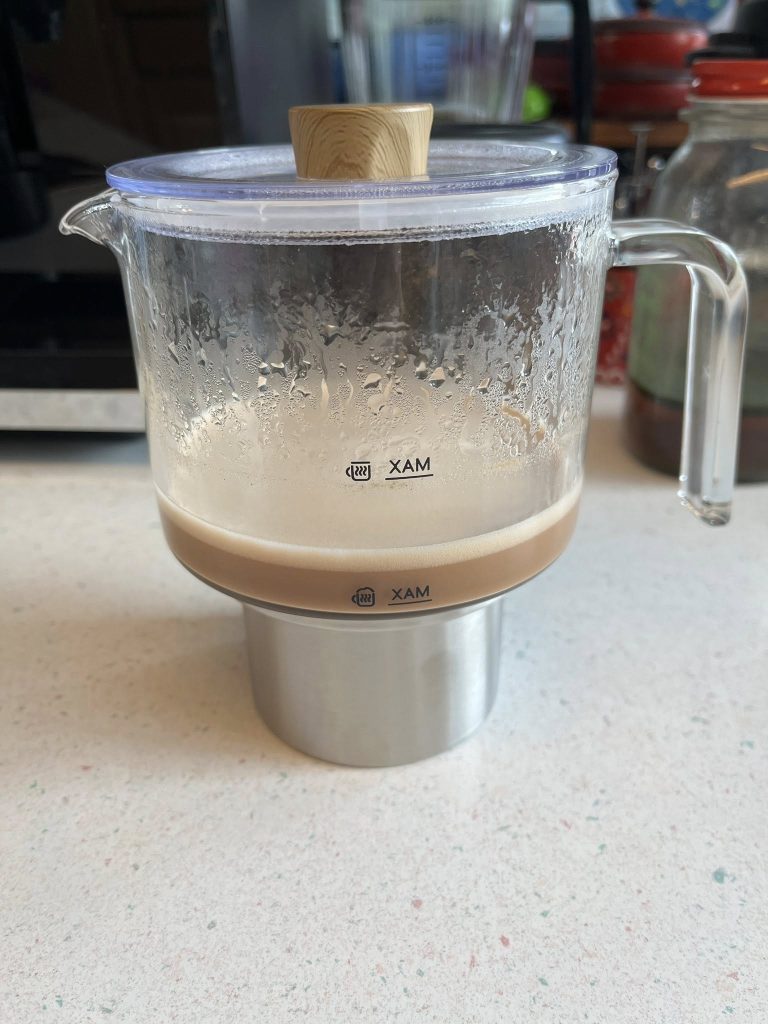 Glass coffee maker with wooden knob brewing coffee