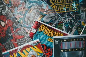 A crowded convention hall at San Diego Comic-Con with superhero displays