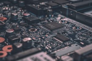 A high-tech circuit board representing the massive power needs of AI data centers